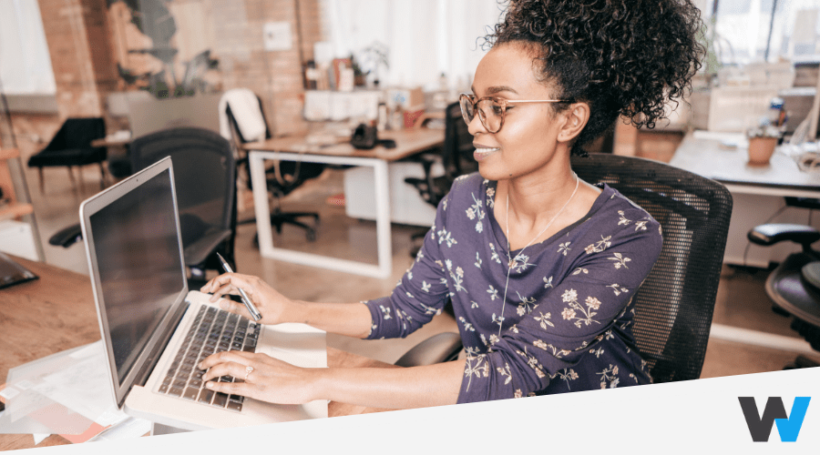 smiling business woman using laptop