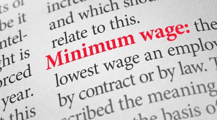 dictionary definition page with minimum wage highlighted in red