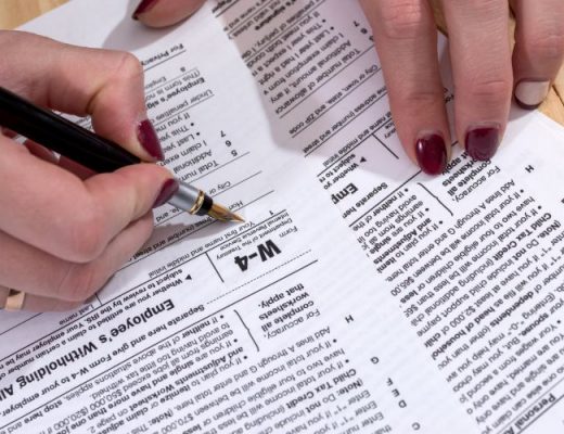 woman filling out w-4 form