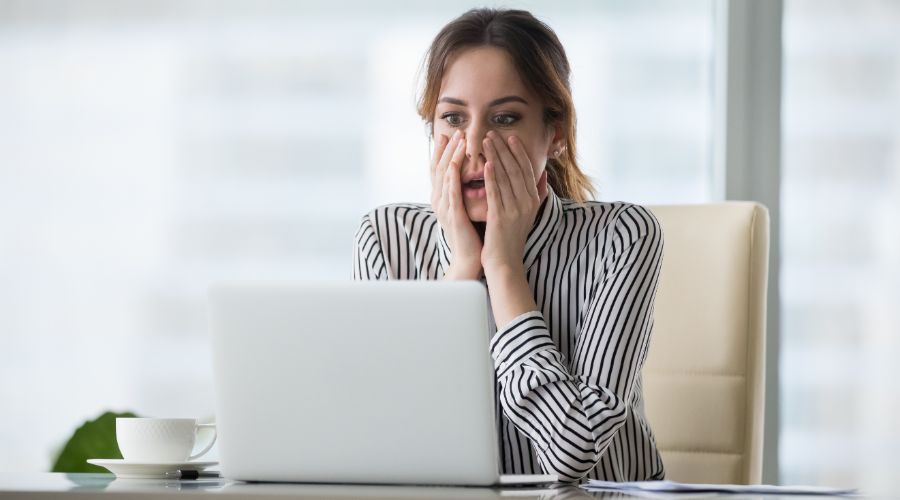 business owner reviewing her finances and realizing she made a big mistake