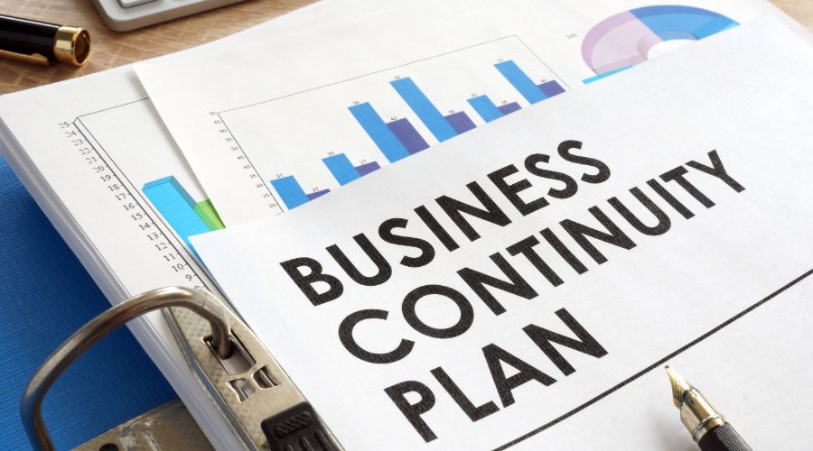 business continuity plan sitting on top of stack of graphs